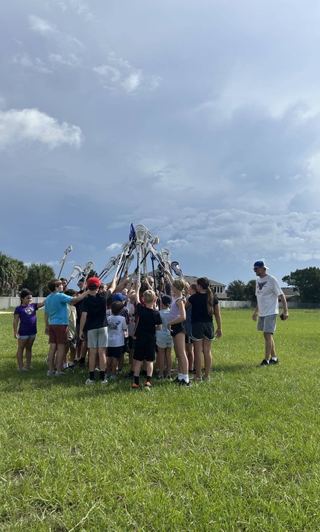 Players putting their racket together, Youth Lacrosse in Oviedo, Florida