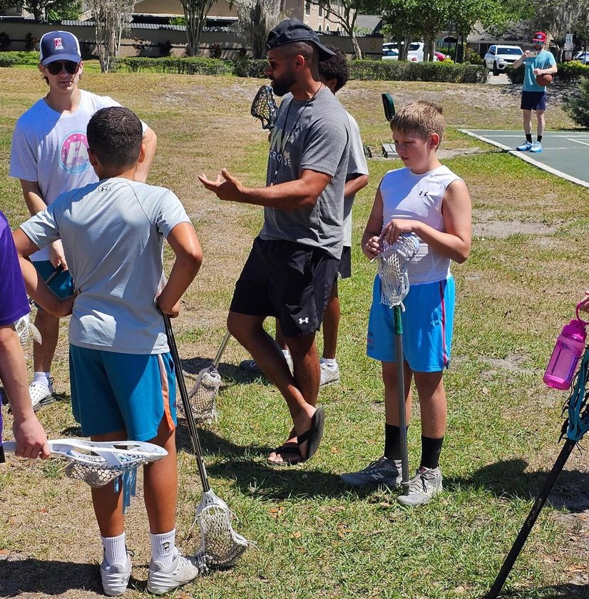 Players listening to coach on sideline