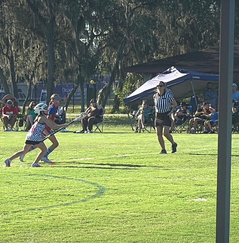 Players listening to coach on sideline