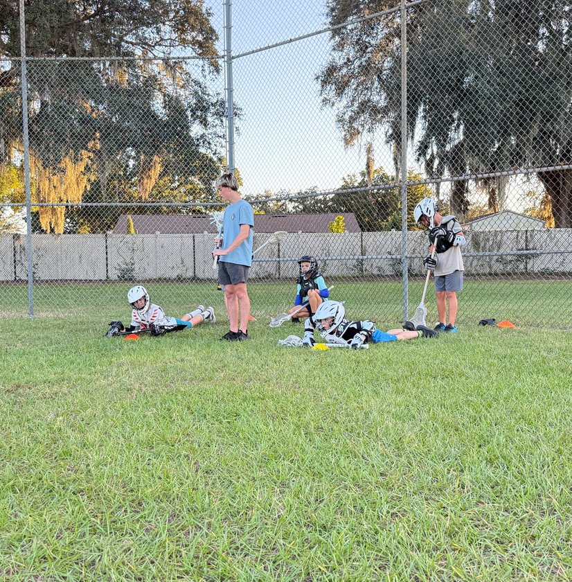 Youth lacrosse team warming up before game