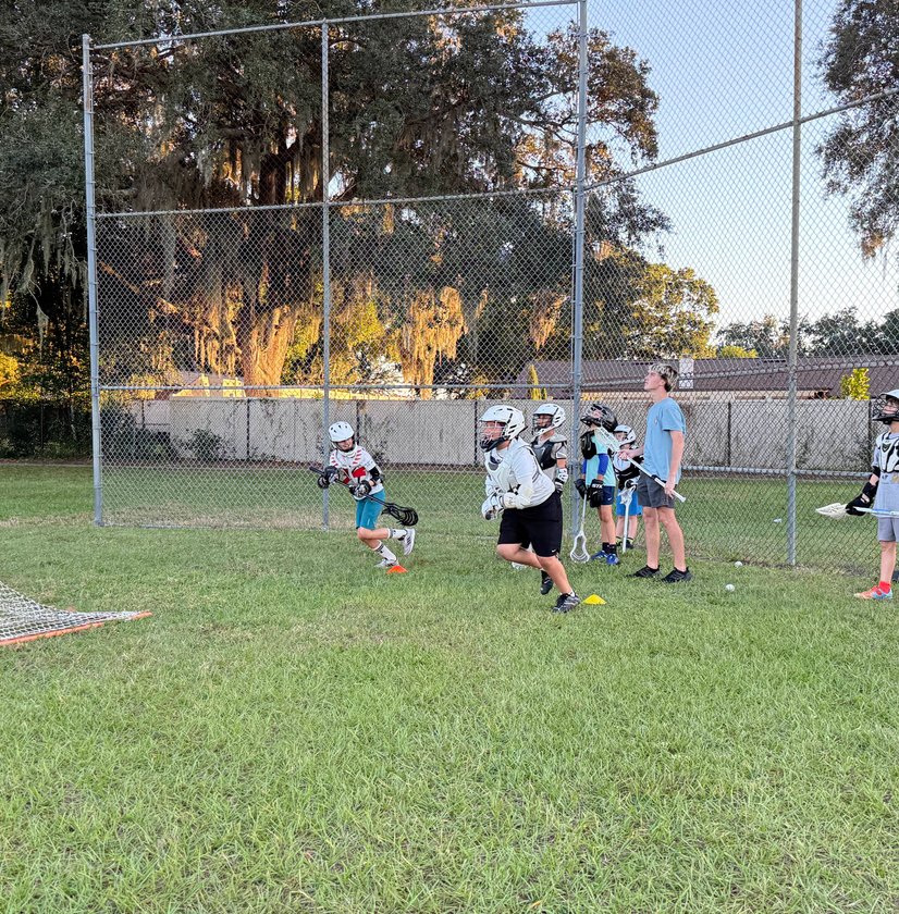 Players listening to coach on sideline
