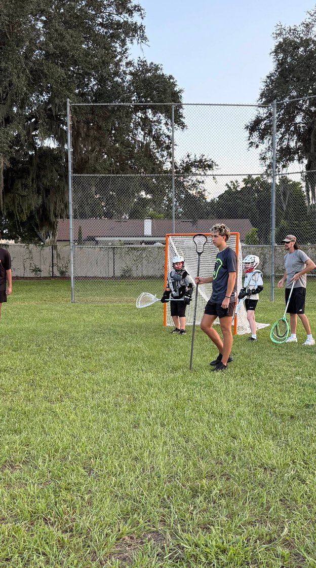 Girls lacrosse team smiling together
