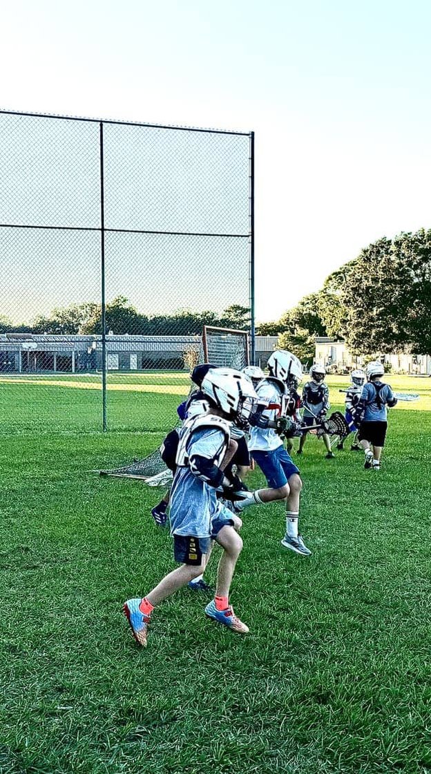 Boy scoring goal during game