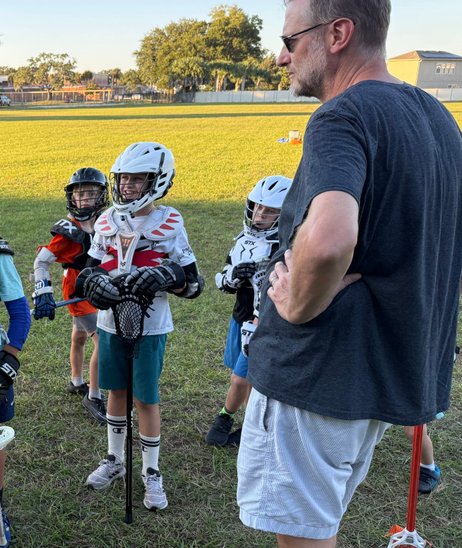 Coach instructing his players